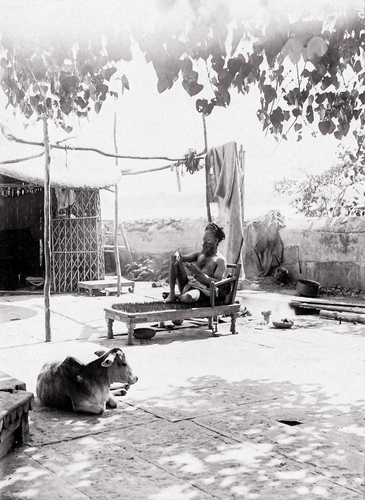 An ascetic? Sitting on nails, Benares (Varanasi), India (c.1890s)